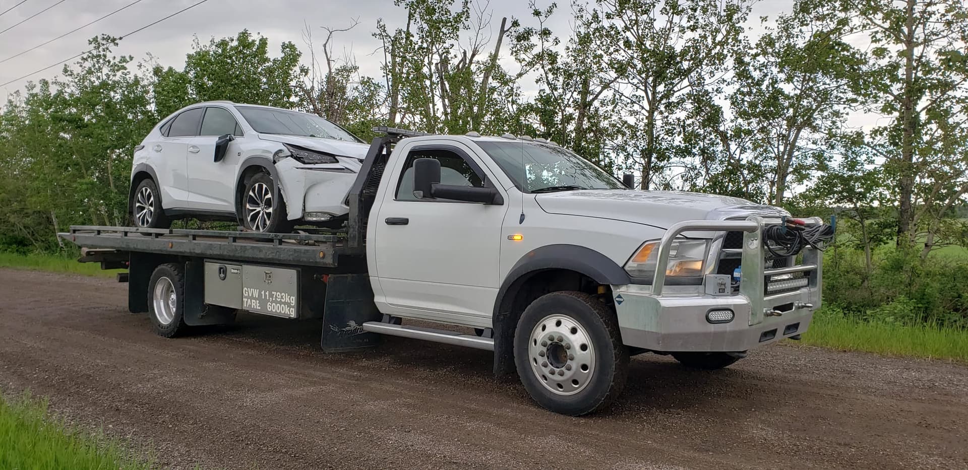Farm truck and student vehicle removal in Camrose