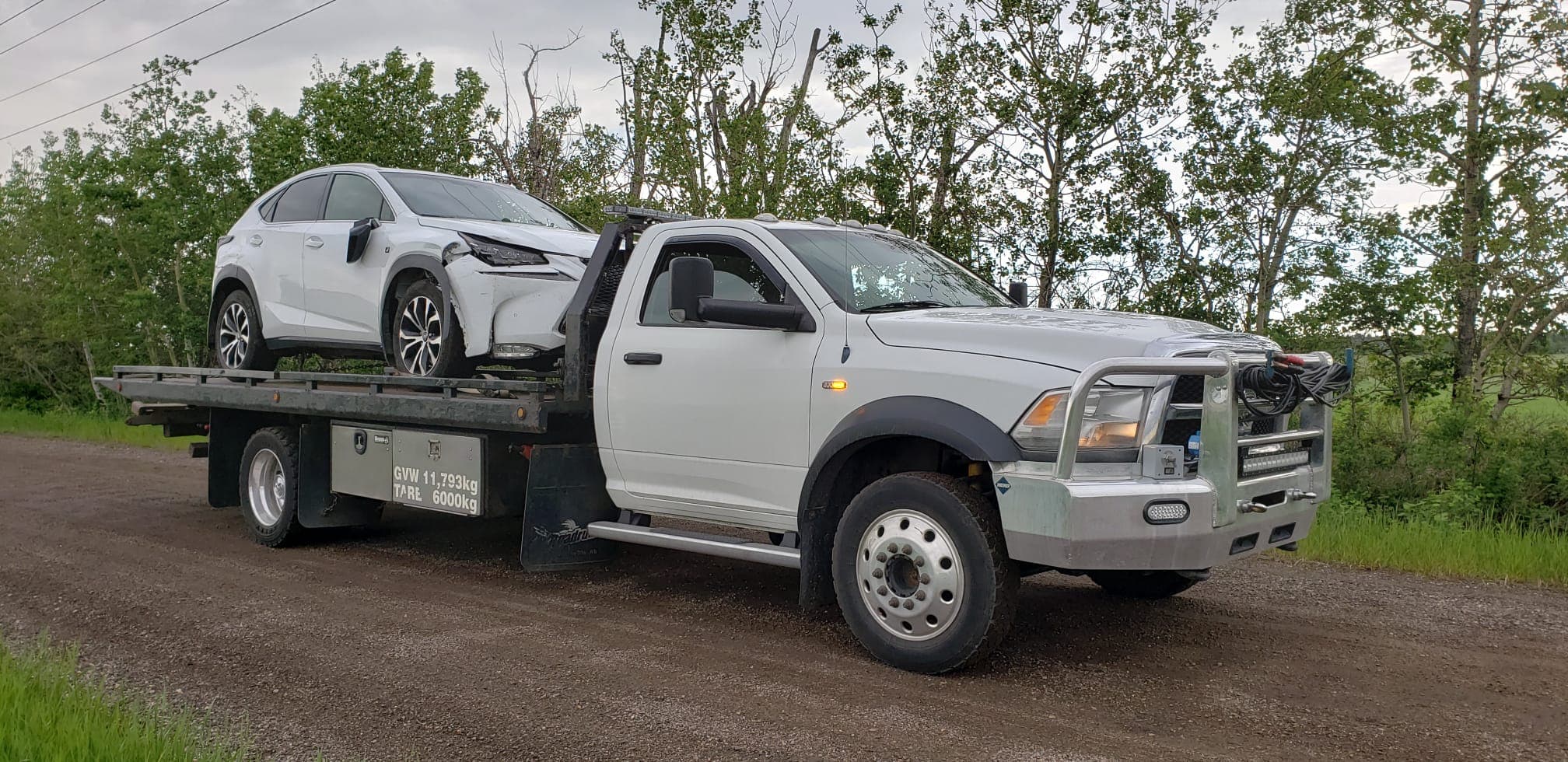 Tow truck hauling a vehicle on an Edmonton-area route
